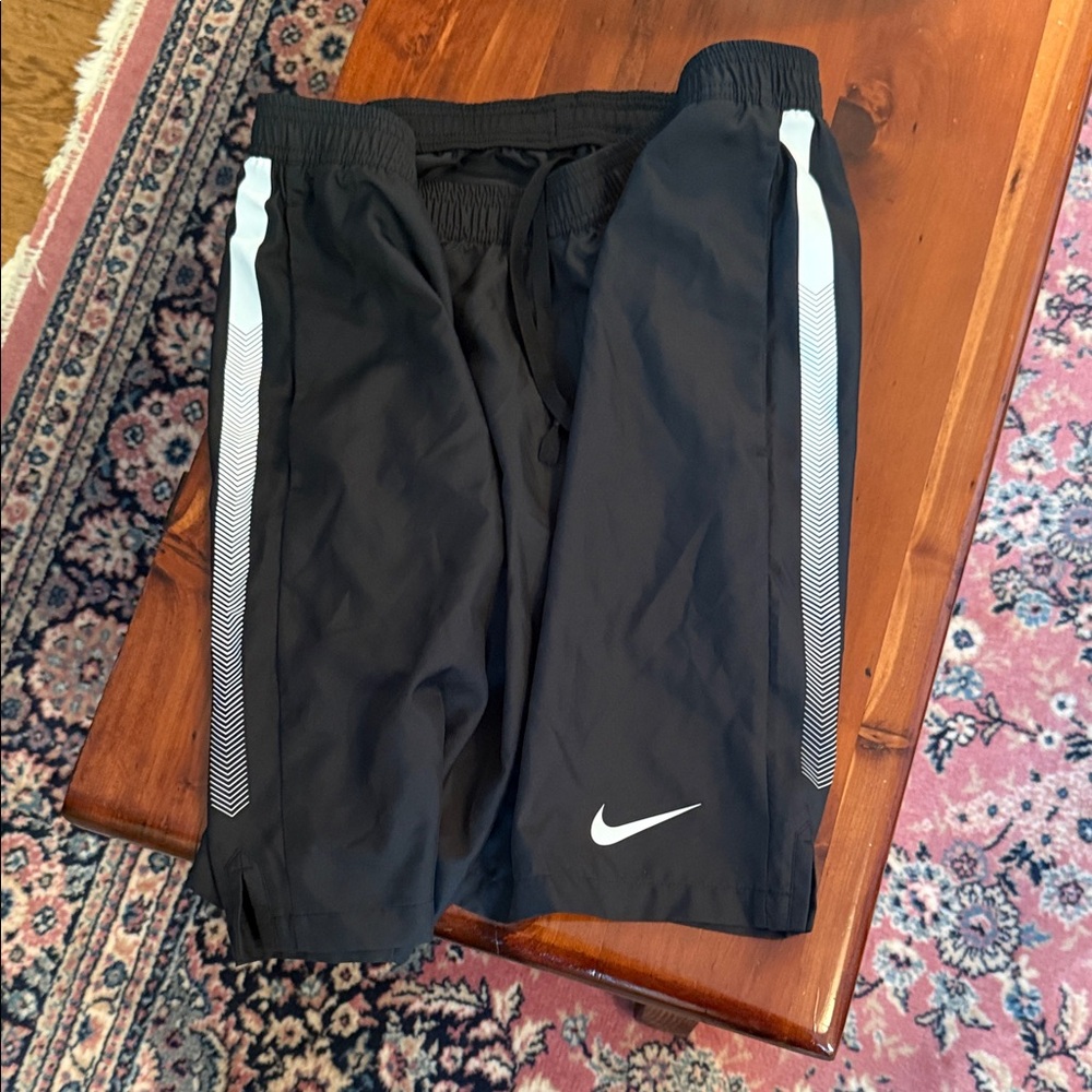 Nike Black Athletic Shorts with White Chevron Side Stripes